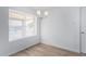 Simple dining area with wood floors and window at 9676 W Mountain View Rd # B, Peoria, AZ 85345