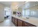 Spacious bathroom with double vanity and view into bedroom at 10406 E Laguna Azul Ave, Mesa, AZ 85209