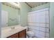 Clean bathroom with shower/tub combo and updated vanity at 10406 E Laguna Azul Ave, Mesa, AZ 85209