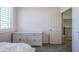 Bright bedroom with white dresser and neutral colored walls at 10406 E Laguna Azul Ave, Mesa, AZ 85209