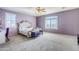 Elegant main bedroom with plush carpet and large windows at 10406 E Laguna Azul Ave, Mesa, AZ 85209