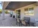 Relaxing covered patio with seating area, perfect for outdoor dining at 10406 E Laguna Azul Ave, Mesa, AZ 85209