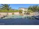 Inviting swimming pool with waterfall feature, surrounded by a spacious patio at 10406 E Laguna Azul Ave, Mesa, AZ 85209