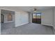 Spacious bedroom with carpet flooring and private balcony access at 10410 N Cave Creek Rd # 2011, Phoenix, AZ 85020