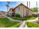 Attractive exterior of a two-story condo with landscaped grounds at 10410 N Cave Creek Rd # 2011, Phoenix, AZ 85020