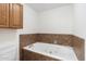 Relax in this bathroom's luxurious jetted tub at 1120 E Kael Cir, Mesa, AZ 85203