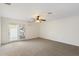 Spacious bedroom with carpet, French doors, and ceiling fan at 1120 E Kael Cir, Mesa, AZ 85203