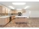 Spacious kitchen with island and light wood cabinets at 1120 E Kael Cir, Mesa, AZ 85203