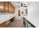 Bright laundry room with lots of cabinet space and a workspace at 1120 E Kael Cir, Mesa, AZ 85203