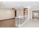 Spacious living room with built-in shelving and neutral carpeting at 1120 E Kael Cir, Mesa, AZ 85203