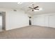 Large living room with high ceilings and ceiling fan at 1120 E Kael Cir, Mesa, AZ 85203