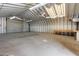 Spacious workshop with roll-up door and ample space at 1120 E Kael Cir, Mesa, AZ 85203