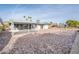 Spacious backyard with gravel and a covered patio area at 11225 S Tomah St, Phoenix, AZ 85044