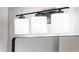 Three-light vanity fixture with modern design at 11225 S Tomah St, Phoenix, AZ 85044