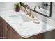 Bathroom vanity with white countertop and gold fixtures at 11225 S Tomah St, Phoenix, AZ 85044