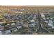 Aerial view of a house and surrounding neighborhood, showcasing the property's location and setting at 12 E Foothill Dr, Phoenix, AZ 85020