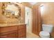 Elegant bathroom with granite countertop and ornate mirror at 12 E Foothill Dr, Phoenix, AZ 85020