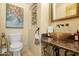 Stylish powder room with glass vessel sink and granite vanity at 12 E Foothill Dr, Phoenix, AZ 85020