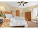 Bedroom with wooden furniture and white bedding at 12 E Foothill Dr, Phoenix, AZ 85020