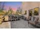 Landscaped patio with multiple bonsai trees and seating area at 12 E Foothill Dr, Phoenix, AZ 85020