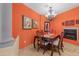 Bright dining room with fireplace and chandelier, features a wooden table with six chairs at 12 E Foothill Dr, Phoenix, AZ 85020