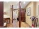 Bright entryway with tile flooring and wood storage cabinet at 12 E Foothill Dr, Phoenix, AZ 85020