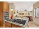 Kitchen with granite countertop and modern cooktop at 12 E Foothill Dr, Phoenix, AZ 85020