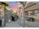 Outdoor patio with spiral staircase, grill, and seating area at 12 E Foothill Dr, Phoenix, AZ 85020