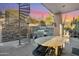 Outdoor patio with spiral staircase, grill, and seating area at 12 E Foothill Dr, Phoenix, AZ 85020