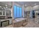 Luxurious bathroom with soaking tub, walk-in shower, and granite vanity at 12657 N 135Th St, Scottsdale, AZ 85259