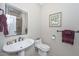 Elegant bathroom with pedestal sink and modern toilet at 12657 N 135Th St, Scottsdale, AZ 85259