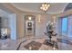 Bright and airy entryway with marble floors and a view into the hallway beyond at 12657 N 135Th St, Scottsdale, AZ 85259