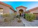 Elegant entryway with arched doorway and landscaping at 12657 N 135Th St, Scottsdale, AZ 85259