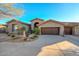 Two-car garage and landscaped front yard at 12657 N 135Th St, Scottsdale, AZ 85259