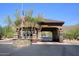 Gated community entrance with flag and security booth at 12657 N 135Th St, Scottsdale, AZ 85259