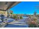 Covered patio with lounge chairs and mountain views at 12657 N 135Th St, Scottsdale, AZ 85259