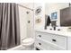 Clean bathroom with white vanity and gray shower curtain at 13235 N 24Th Ave, Phoenix, AZ 85029