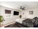 Serene bedroom with dark-colored bedding and ceiling fan at 13235 N 24Th Ave, Phoenix, AZ 85029