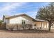 White brick ranch house with a spacious yard and mature trees at 13235 N 24Th Ave, Phoenix, AZ 85029