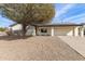 White brick ranch home with solar panels and a spacious gravel driveway at 13235 N 24Th Ave, Phoenix, AZ 85029