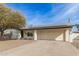 Ranch style home with solar panels, attached garage, and gravel landscaping at 13235 N 24Th Ave, Phoenix, AZ 85029