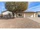 White brick ranch house with solar panels, attached garage, and mature landscaping at 13235 N 24Th Ave, Phoenix, AZ 85029