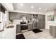 Modern kitchen with stainless steel appliances and gray cabinets at 13235 N 24Th Ave, Phoenix, AZ 85029