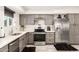 Modern kitchen with gray cabinets and stainless steel appliances at 13235 N 24Th Ave, Phoenix, AZ 85029