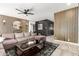 Modern living room featuring a sectional sofa, coffee table, and statement wall at 13235 N 24Th Ave, Phoenix, AZ 85029