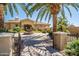 Elegant home with gated entry, fountain, and mature palm trees at 1367 S Country Club Dr # 1024, Mesa, AZ 85210