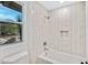 Clean bathroom with a shower/tub combo and window at 1604 E Sheena Dr, Phoenix, AZ 85022