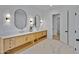 Elegant bathroom with double vanity and free-standing tub at 1604 E Sheena Dr, Phoenix, AZ 85022