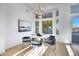 Elegant dining area with hardwood floors and large windows at 1604 E Sheena Dr, Phoenix, AZ 85022