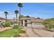 House exterior featuring Spanish-style architecture and landscaping at 1604 E Sheena Dr, Phoenix, AZ 85022